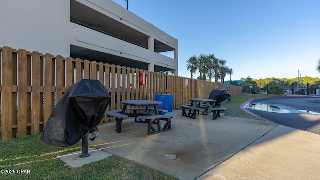 view of patio / terrace with a fenced in pool