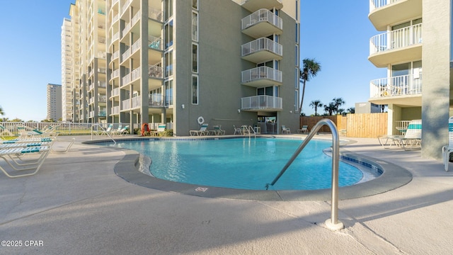 view of pool featuring a patio