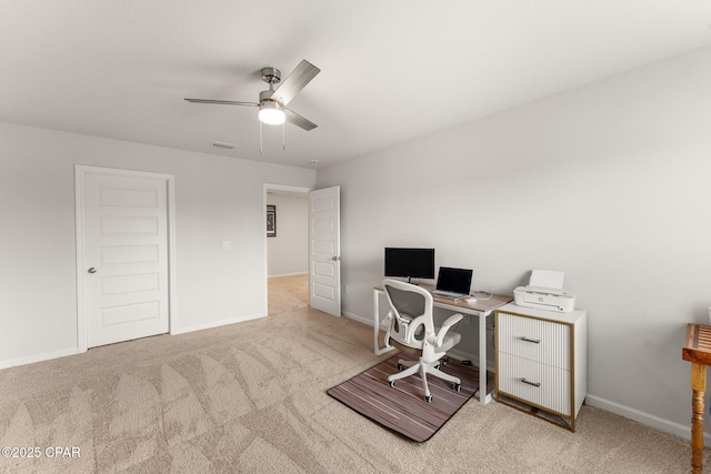 office featuring light carpet and ceiling fan