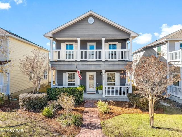 view of front of home featuring a balcony and a porch