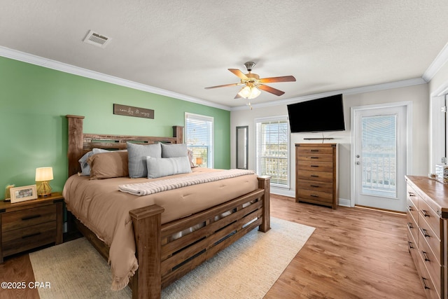 bedroom with access to exterior, ornamental molding, a textured ceiling, ceiling fan, and light hardwood / wood-style floors