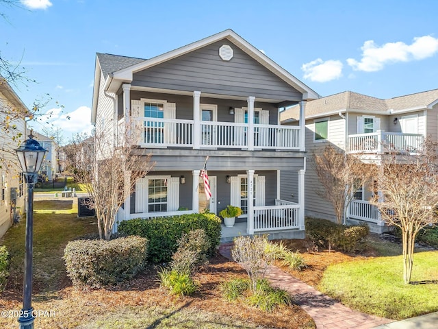 view of front of property with a porch and a balcony