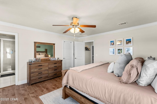 bedroom featuring ensuite bath, ceiling fan, crown molding, and light hardwood / wood-style floors