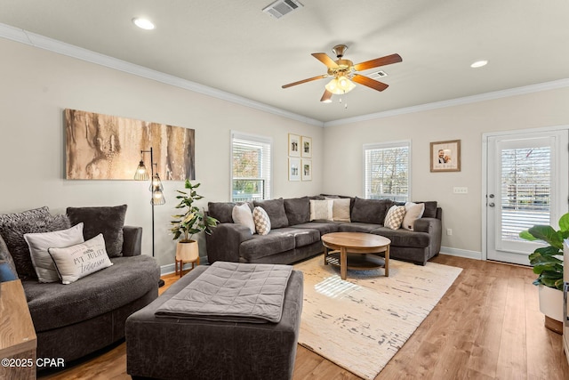 living room with ceiling fan, hardwood / wood-style floors, and ornamental molding