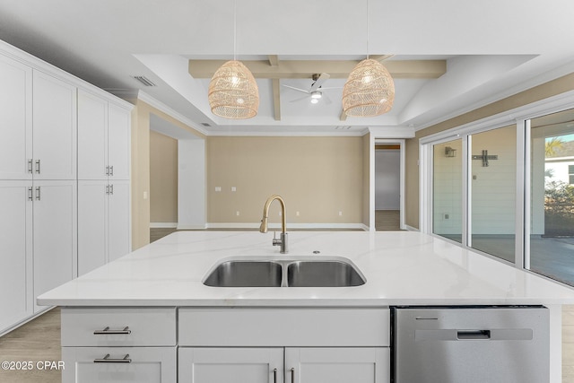 kitchen featuring stainless steel dishwasher, pendant lighting, a center island with sink, white cabinets, and a sink