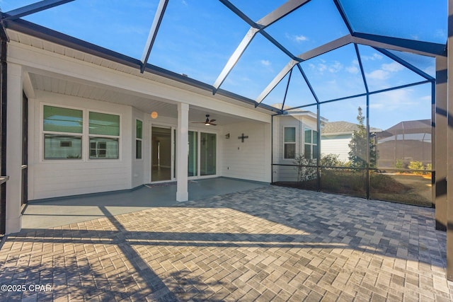 view of patio / terrace featuring a lanai and ceiling fan