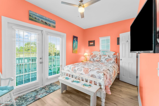 bedroom with ceiling fan, light hardwood / wood-style floors, and access to outside