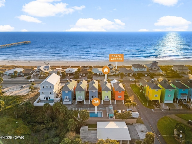 aerial view featuring a water view and a beach view