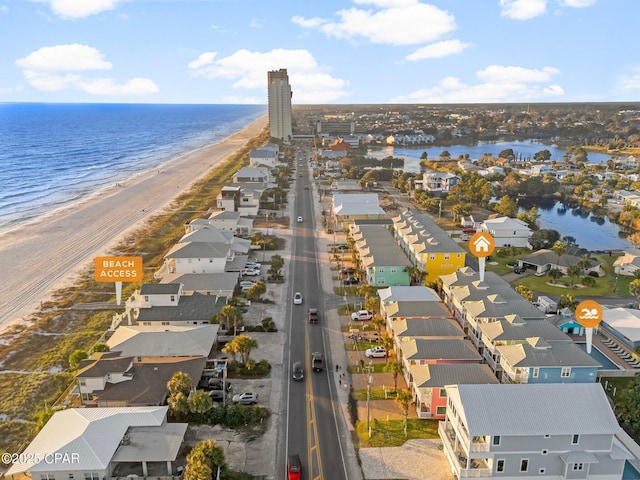 birds eye view of property featuring a view of the beach and a water view