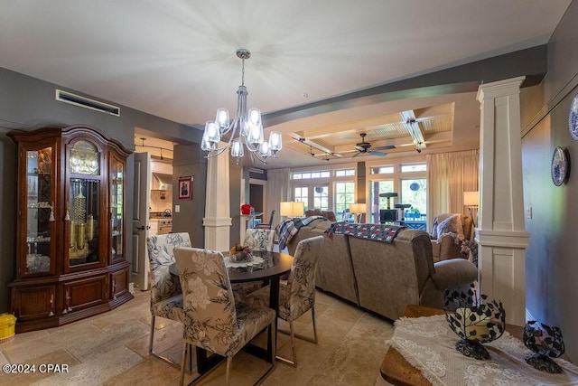 dining room with ceiling fan with notable chandelier, a raised ceiling, and decorative columns