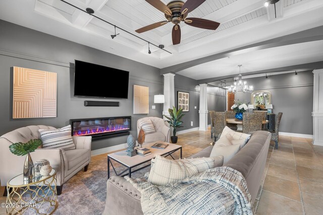 kitchen featuring white cabinetry, wall chimney range hood, and high end appliances