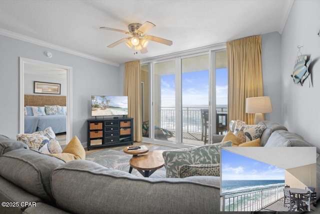 living room with ornamental molding, floor to ceiling windows, and ceiling fan