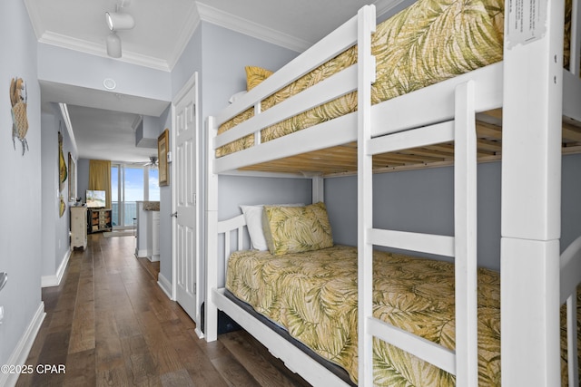 bedroom featuring dark hardwood / wood-style floors and ornamental molding