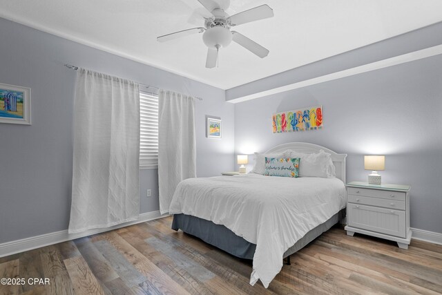 bedroom featuring ceiling fan and wood-type flooring