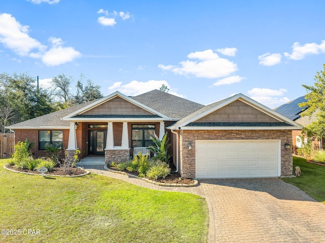 craftsman-style house with a porch, a garage, and a front lawn