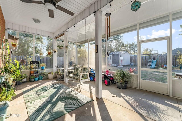 sunroom / solarium featuring ceiling fan