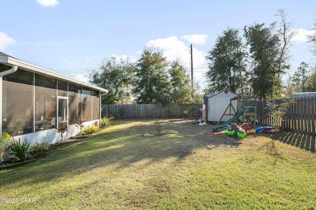 view of yard featuring a shed and a playground