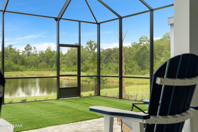 unfurnished sunroom with a water view