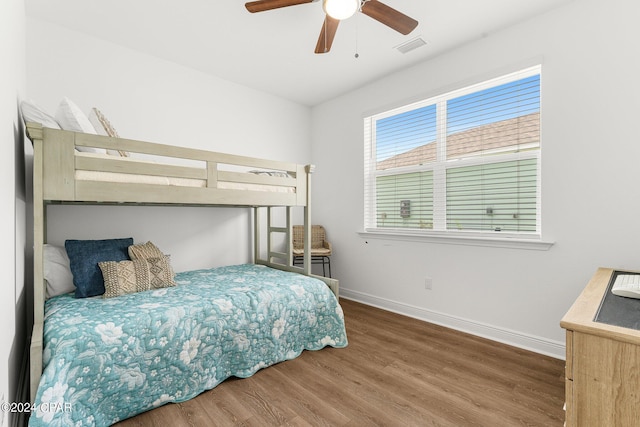 bedroom featuring ceiling fan and hardwood / wood-style floors