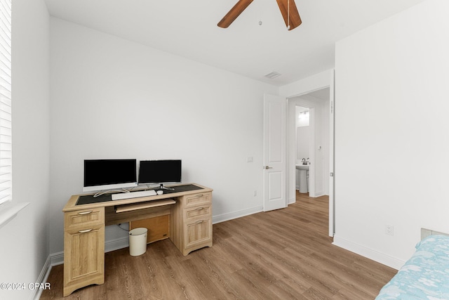 office space featuring light wood-type flooring and ceiling fan