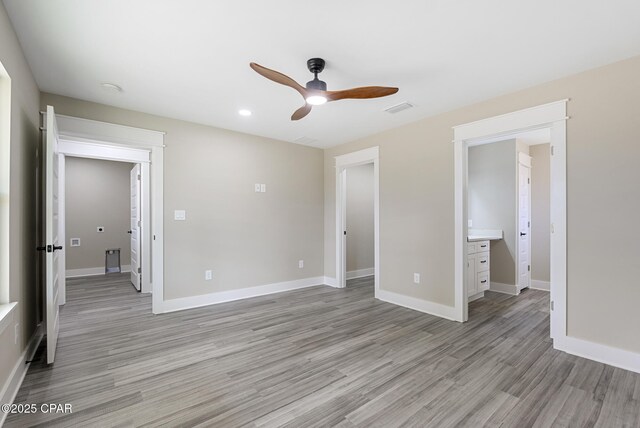 bathroom with hardwood / wood-style flooring, toilet, and shower / bathing tub combination