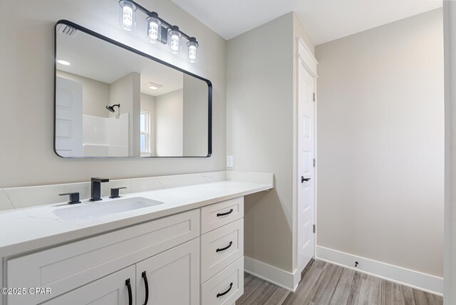 unfurnished bedroom with a closet, ceiling fan, and light hardwood / wood-style flooring