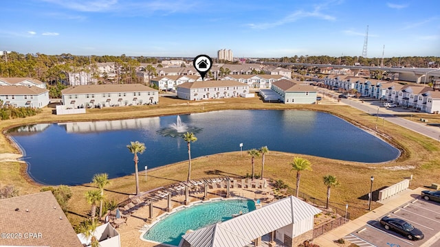 birds eye view of property with a water view