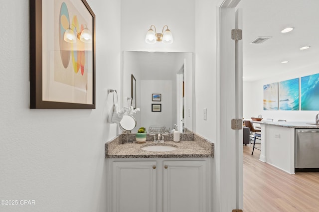 bathroom with vanity and hardwood / wood-style flooring