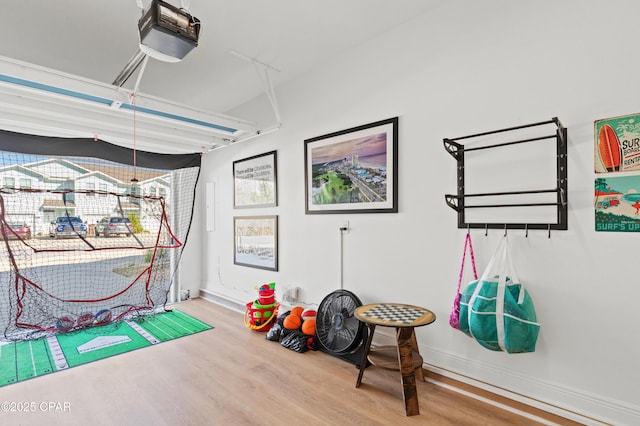 recreation room with hardwood / wood-style floors