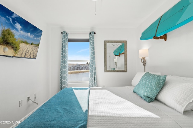 bedroom featuring a water view