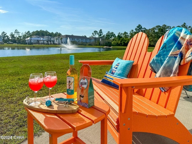 exterior space featuring a water view and a yard