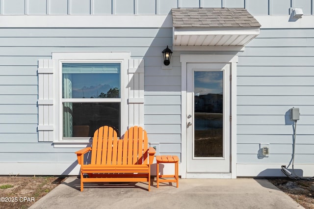 entrance to property featuring a patio area