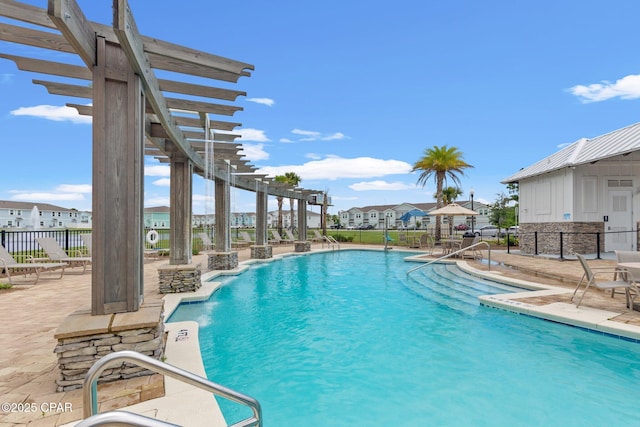 view of pool with a pergola and a patio area