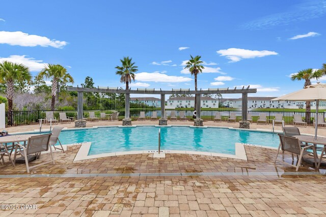 view of pool with a patio and a pergola