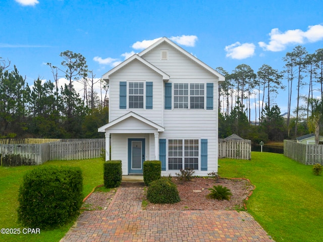 view of property featuring a front yard