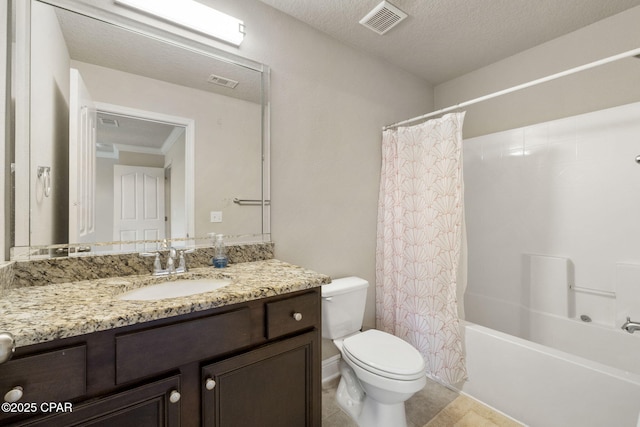 full bathroom featuring tile patterned floors, toilet, a textured ceiling, vanity, and shower / bath combo