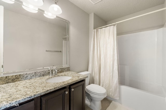 full bathroom featuring shower / bath combination with curtain, vanity, toilet, and a textured ceiling