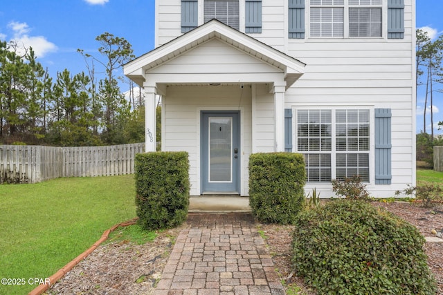 property entrance featuring a yard