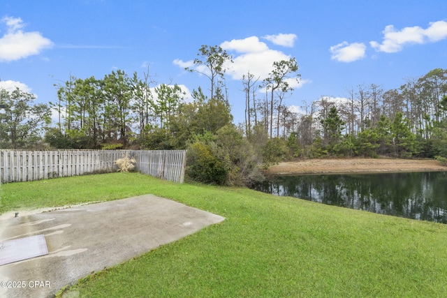 view of yard featuring a water view and a patio area