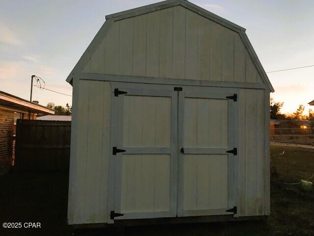 view of outdoor structure at dusk