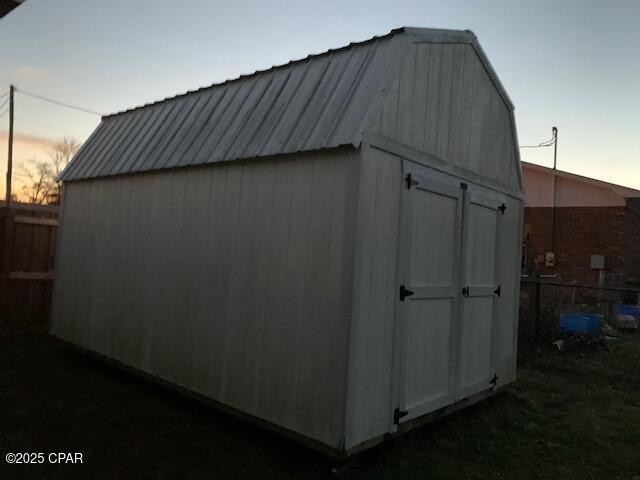 view of outdoor structure at dusk