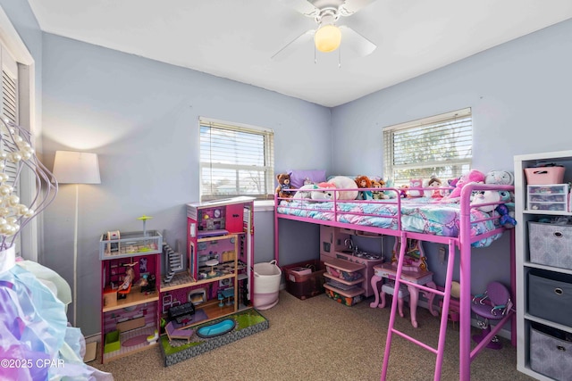 bedroom with a ceiling fan and carpet