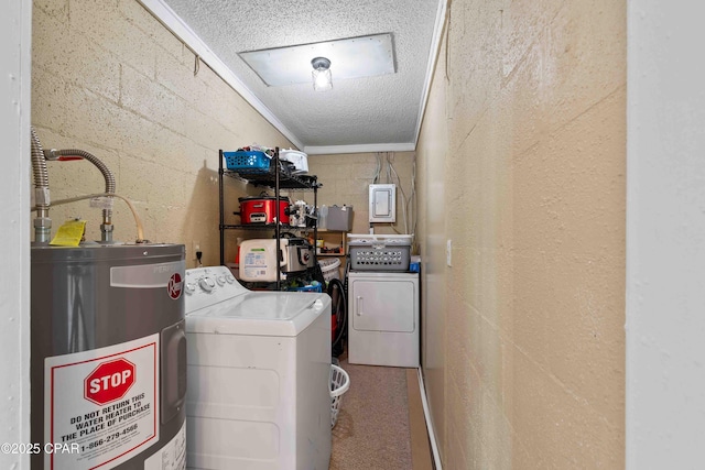 clothes washing area featuring concrete block wall, laundry area, washer and clothes dryer, electric water heater, and a textured ceiling