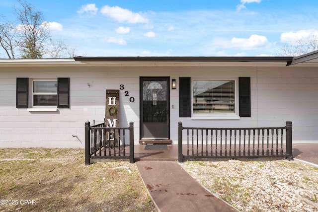 property entrance with concrete block siding