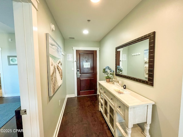 doorway with dark hardwood / wood-style floors