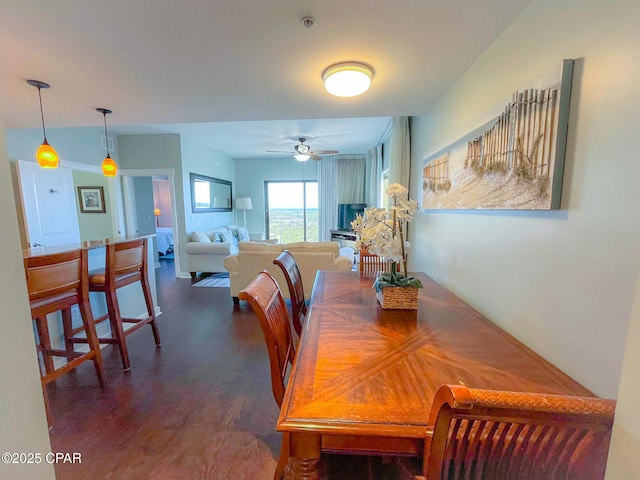 dining room featuring ceiling fan