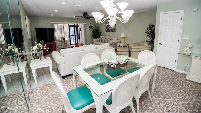 dining space with ceiling fan with notable chandelier