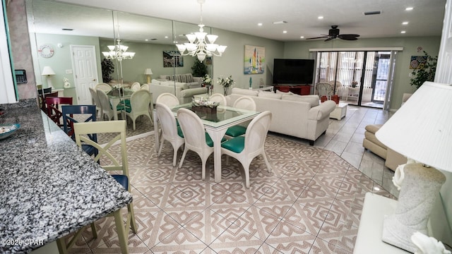 tiled dining room featuring ceiling fan