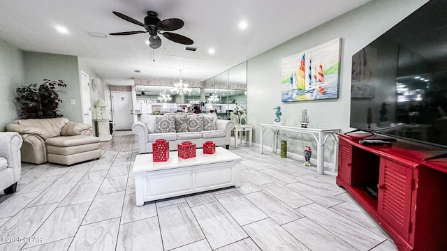 living room with ceiling fan with notable chandelier