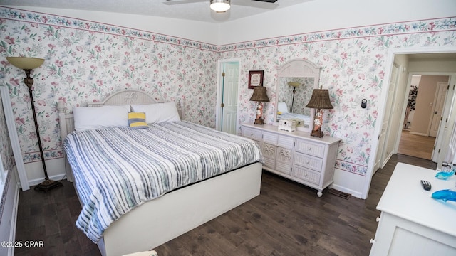 bedroom featuring ceiling fan, dark wood-type flooring, and lofted ceiling